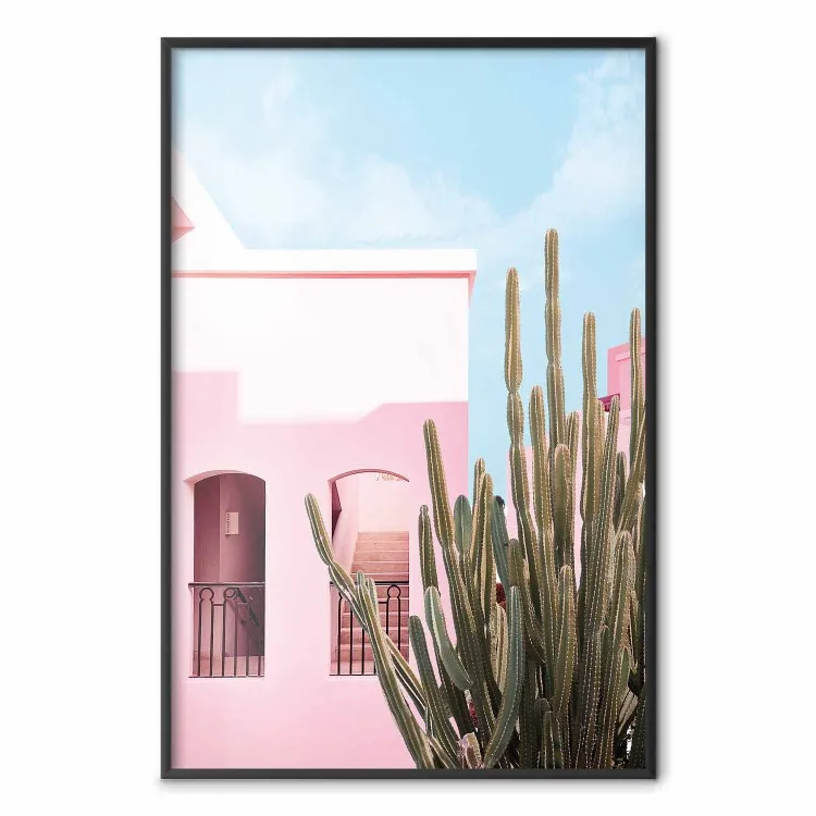 Miami-kaktus - rosa semesterhus mot blå himmel och ljus